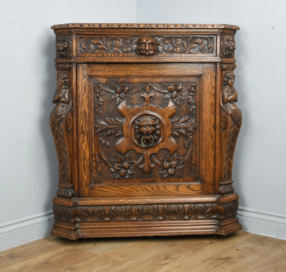 Victorian carved oak green man corner cupboard 