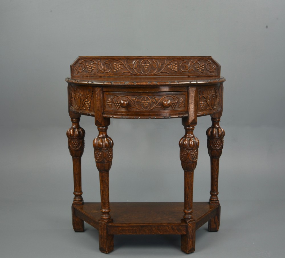 Carved oak demi lune hall side table  View II