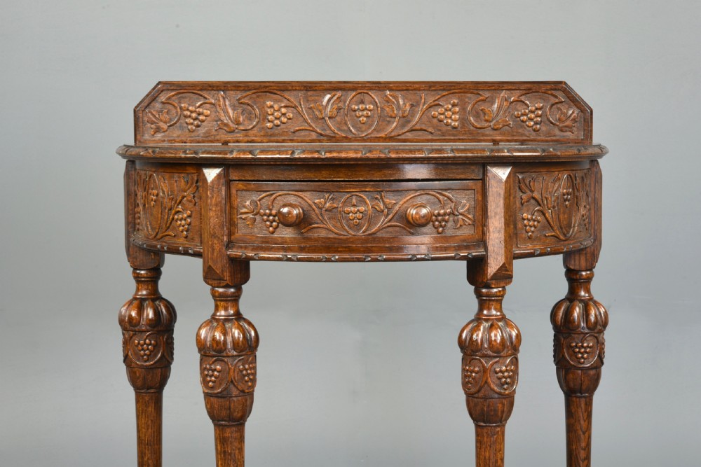 Carved oak demi lune hall side table  View III