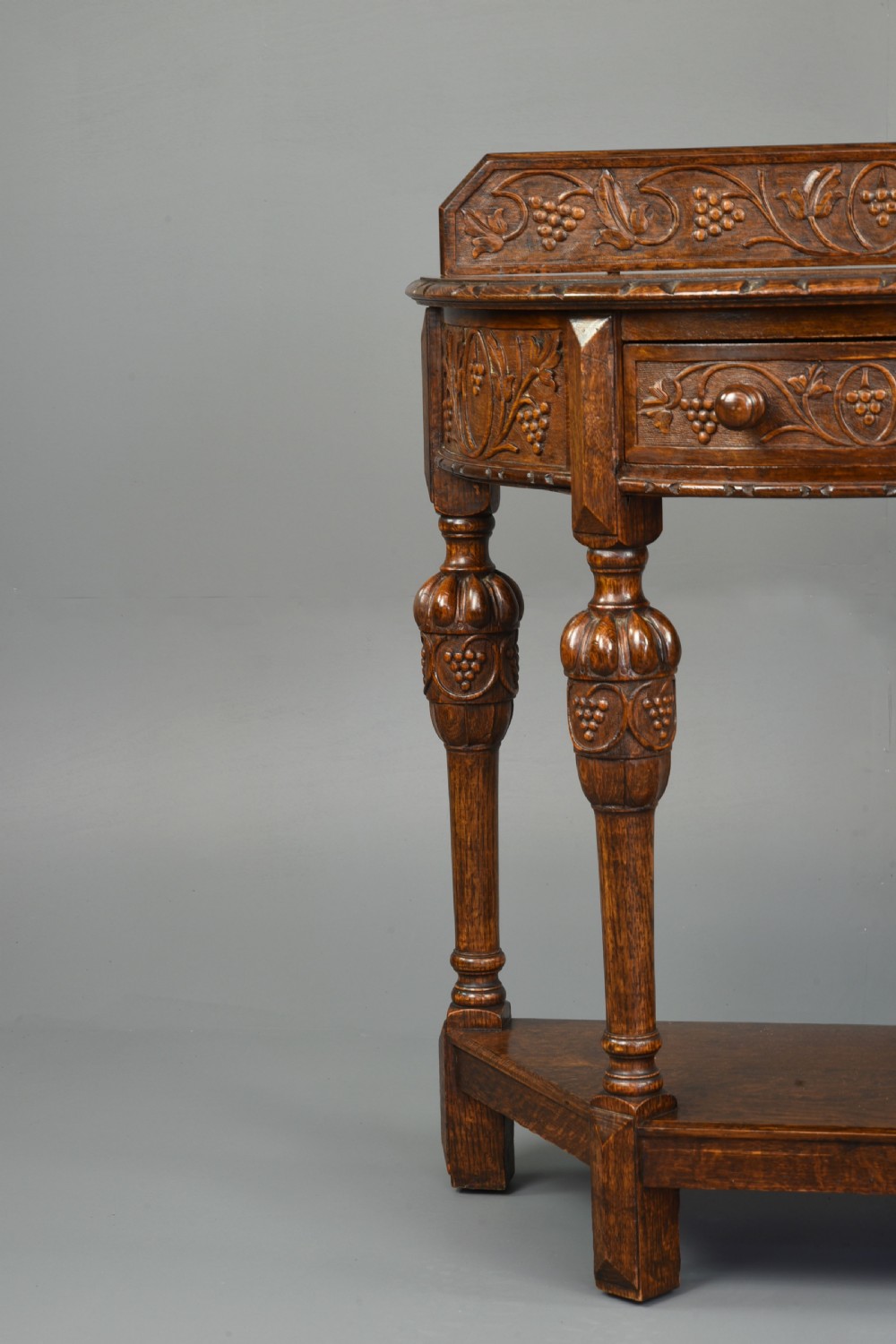 Carved oak demi lune hall side table  View V