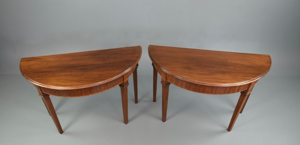 pair of 19th century mahogany Demi lune console tables  View II