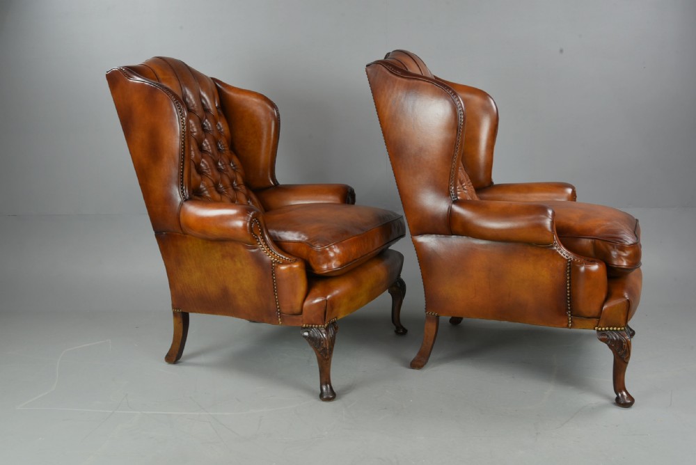 Antique pair of deep buttoned leather wing chairs  View II