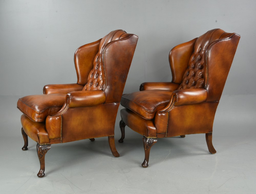 Antique pair of deep buttoned leather wing chairs  View III