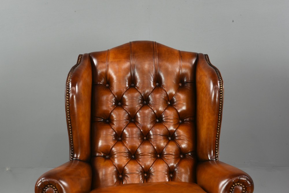 Antique pair of deep buttoned leather wing chairs  View VI
