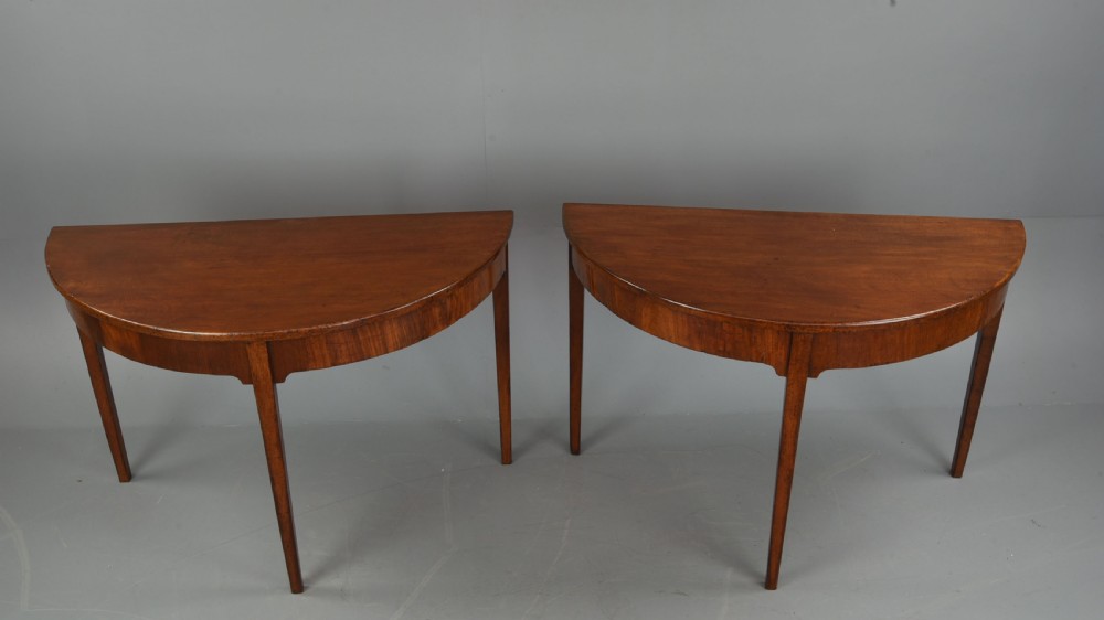 pair of Georgian mahogany demi lune console tables 