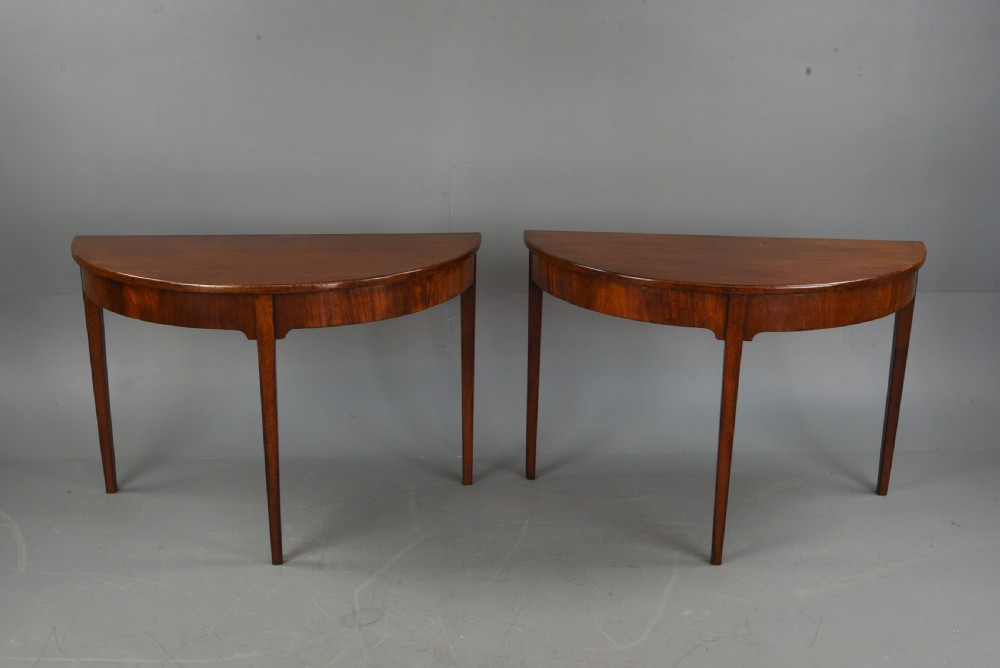 pair of Georgian mahogany demi lune console tables  View II