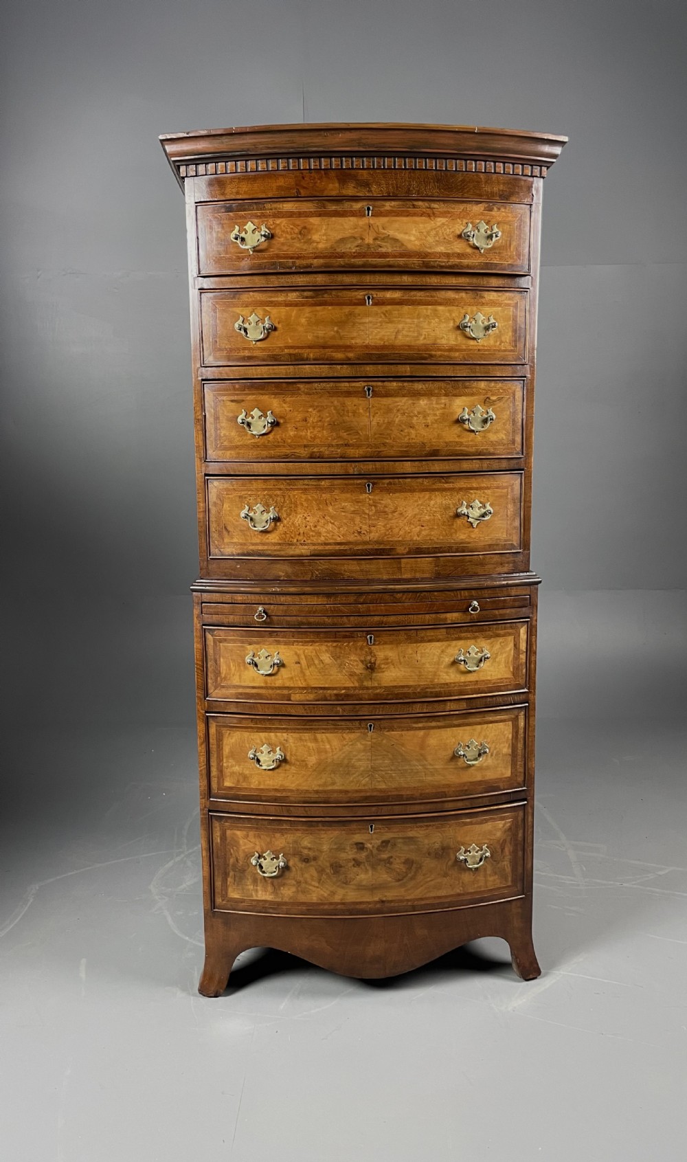 walnut bow front chest on chest 