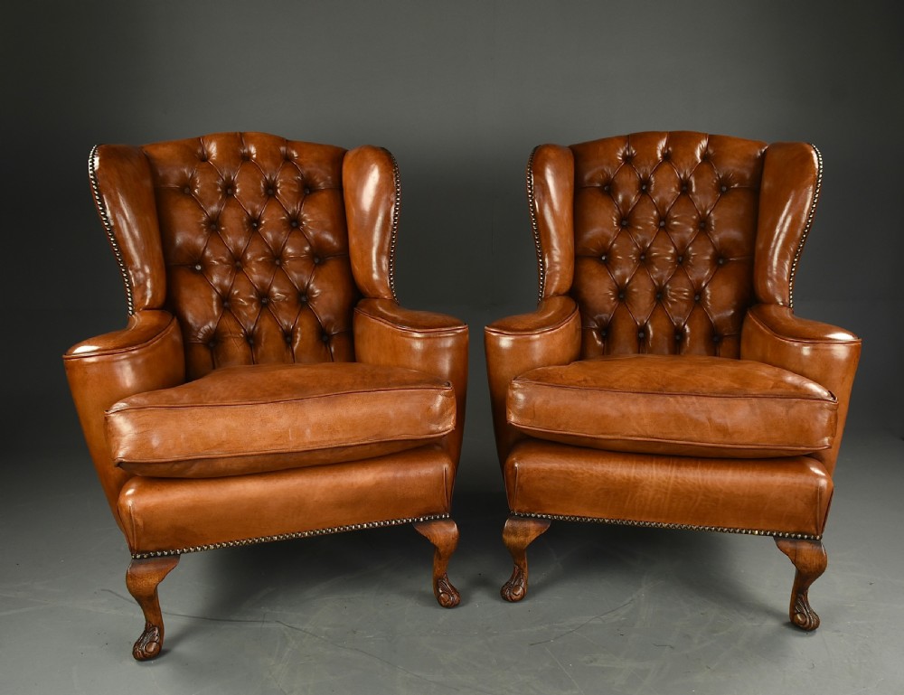 pair of leather wing chairs 