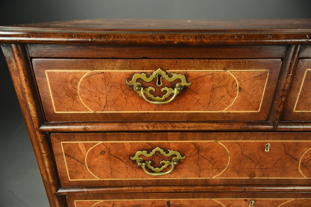 18th century oyster and walnut chest of drawers  View II