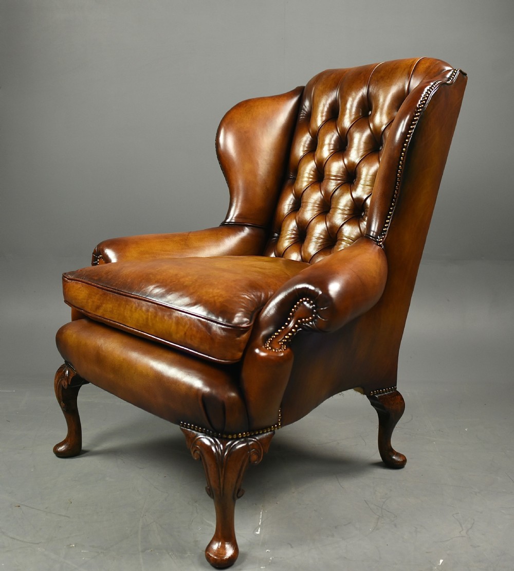 Antique Queen Anne style leather wing chair 