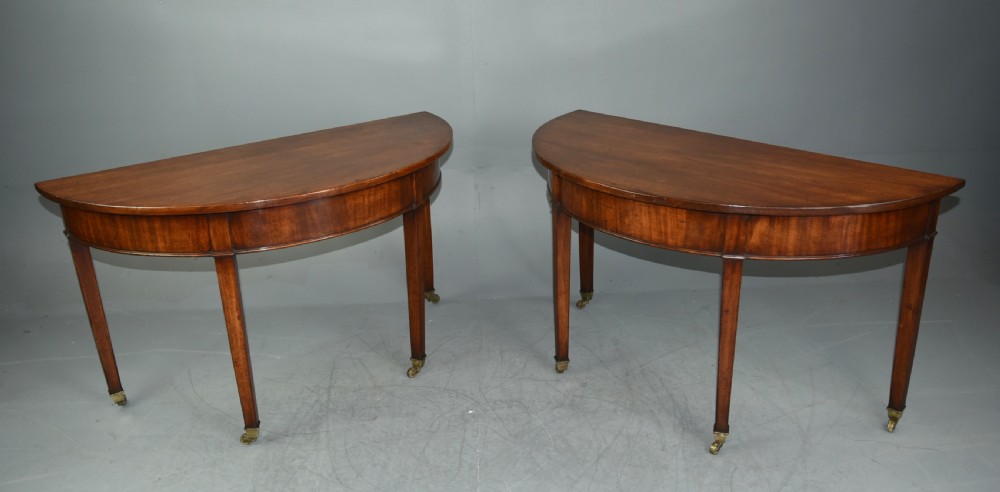 pair of Georgian mahogany demi lune console tables 