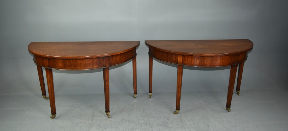 pair of Georgian mahogany demi lune console tables  View II