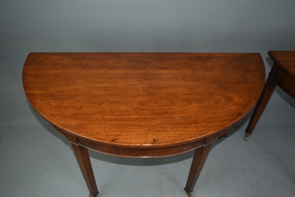 pair of Georgian mahogany demi lune console tables  View III