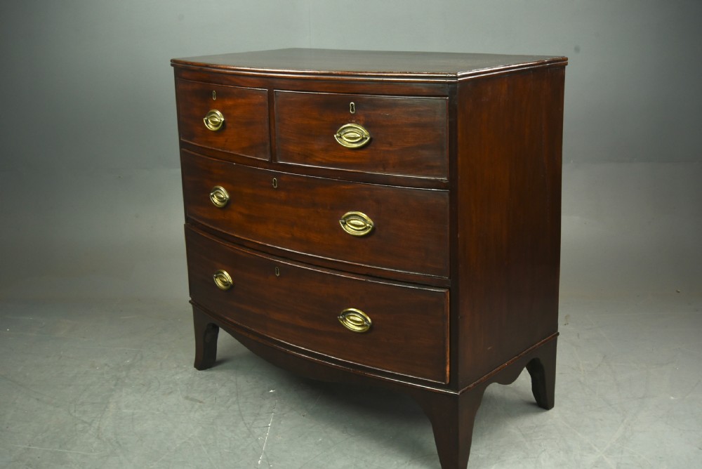 Small Georgian mahogany bow front chest of drawers  View II