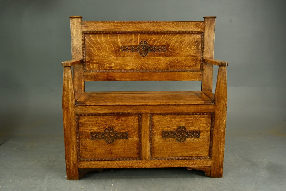 Arts and crafts carved oak hall bench  