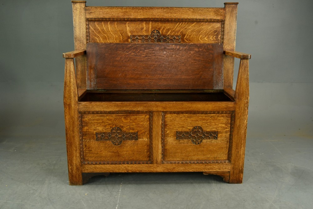 Arts and crafts carved oak hall bench   View II