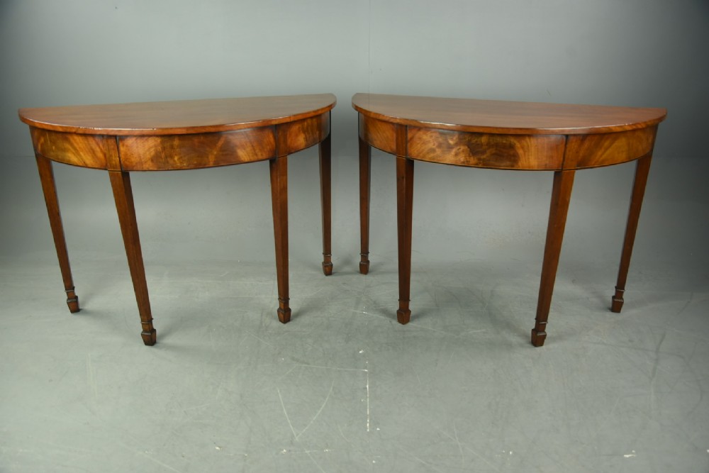 pair of Georgian mahogany demi lune console tables 