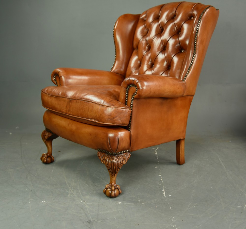 Antique pair of leather wing chairs  View V