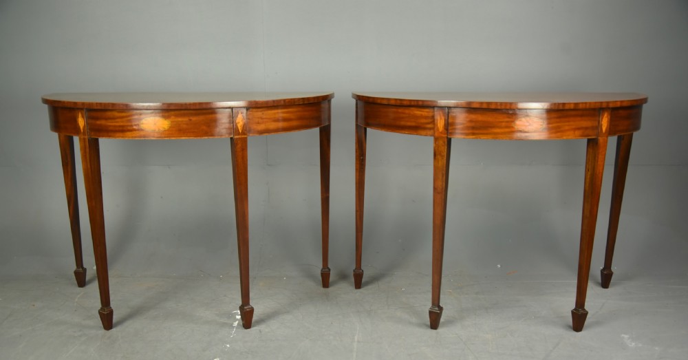 Pair of 19th century mahogany Demi lune console tables 