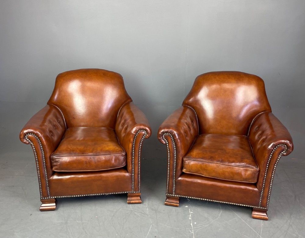 pair of leather arm chairs circa 1900 