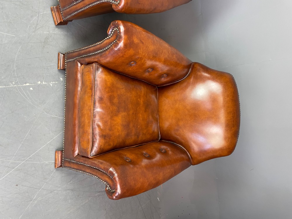 pair of leather arm chairs circa 1900  View V
