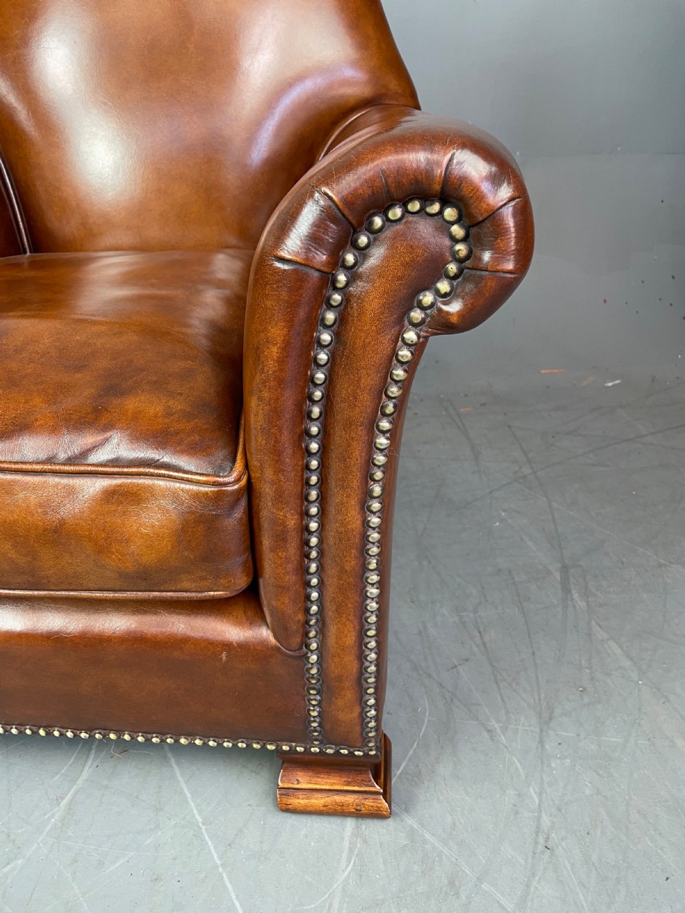 pair of leather arm chairs circa 1900  View XII