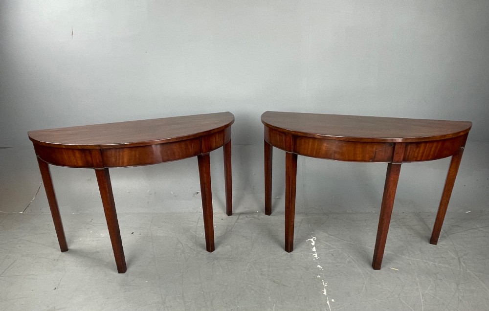 Pair of Georgian mahogany demi lune console tables 