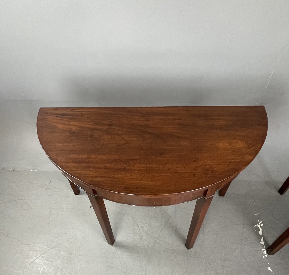 Pair of Georgian mahogany demi lune console tables  View II