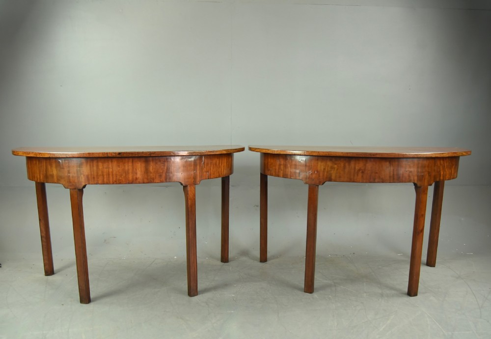 Pair of Georgian mahogany demi lune console tables 