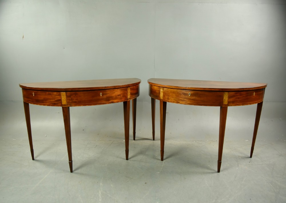 Pair of Georgian mahogany demi lune console tables 