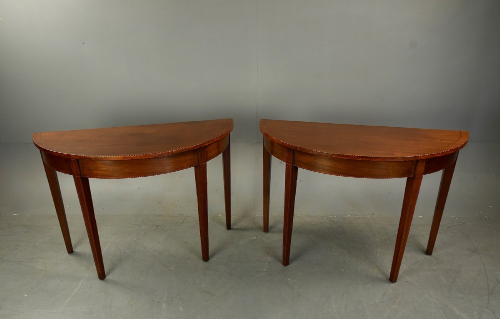 Pair of Georgian mahogany Demi lune console tables  View II