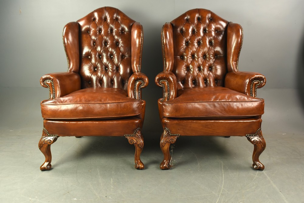 Large pair of leather wing chairs 