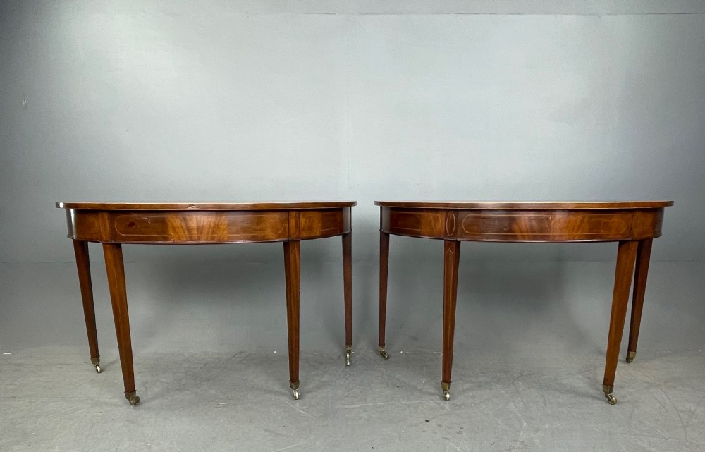 Pair of Georgian mahogany demi lune console tables 