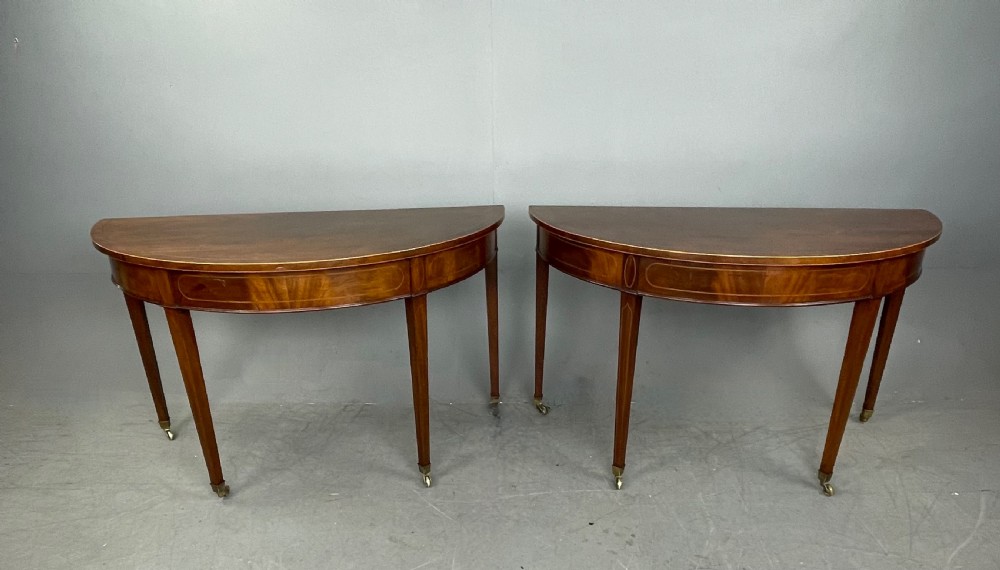 Pair of Georgian mahogany demi lune console tables  View II