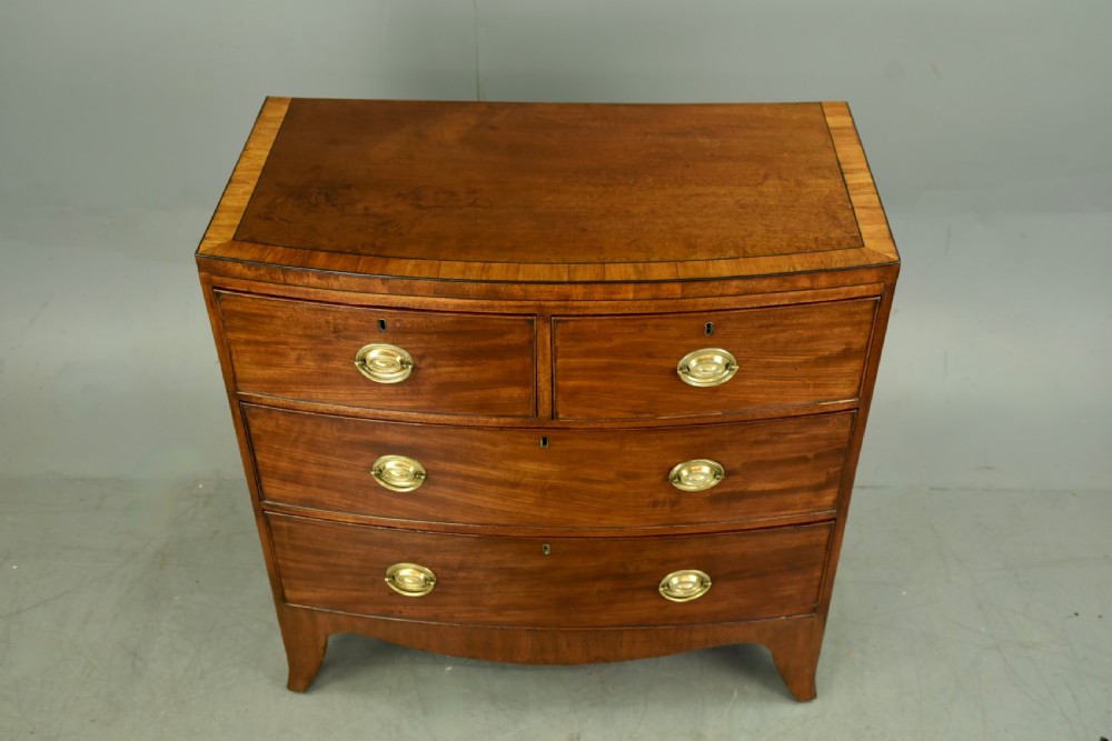 small Georgian mahogany bow front chest of drawers  View II