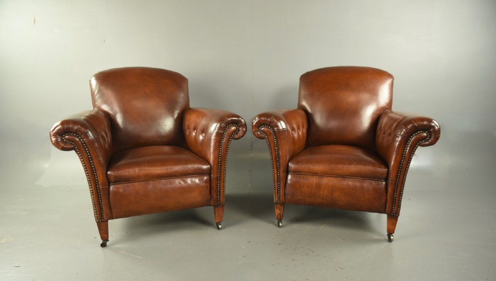 Pair of Victorian leather arm chairs 