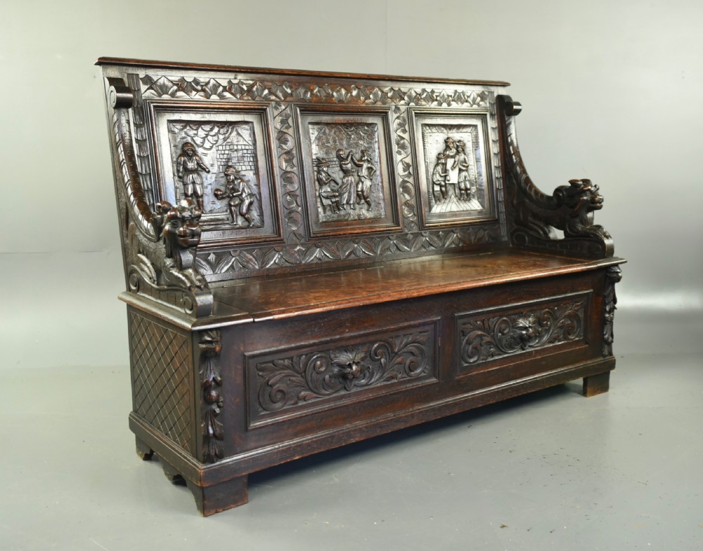 Antique carved oak settle 