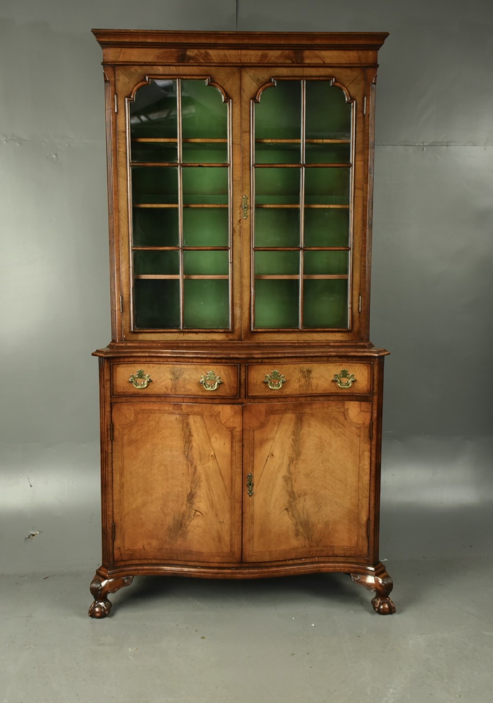 Walnut Queen Anne style serpentine bookcase