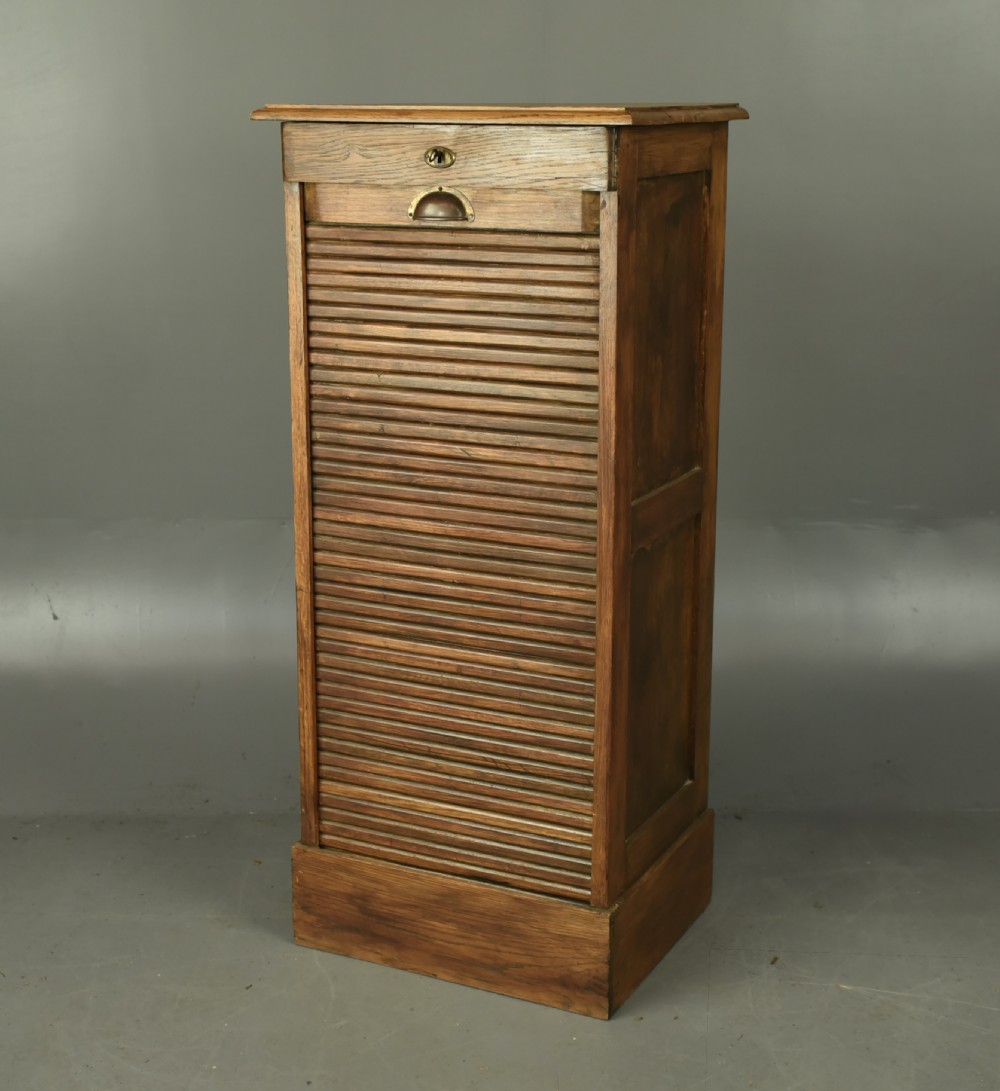 Antique oak tambour front file cabinet 