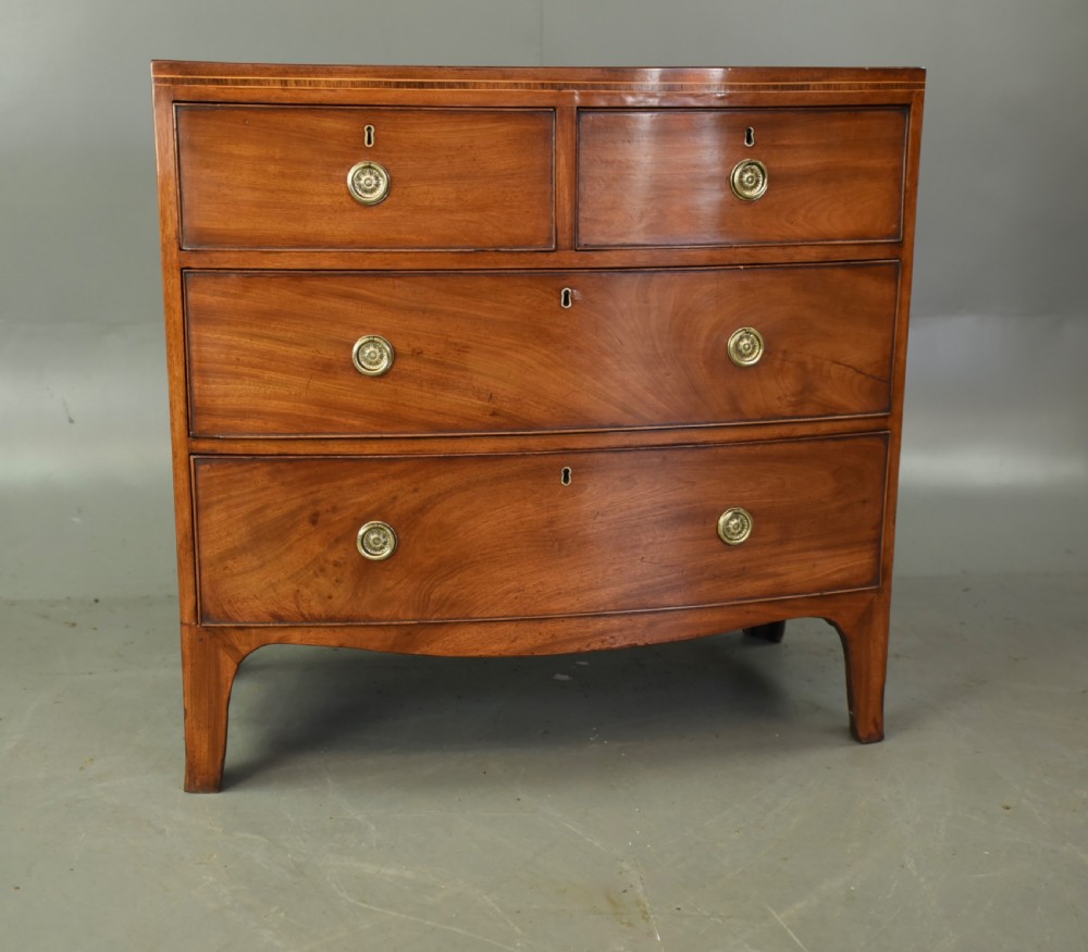 Small Georgian mahogany bow front chest of drawers  View II