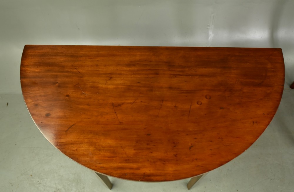 Pair of Georgian mahogany demi lune console tables  View II