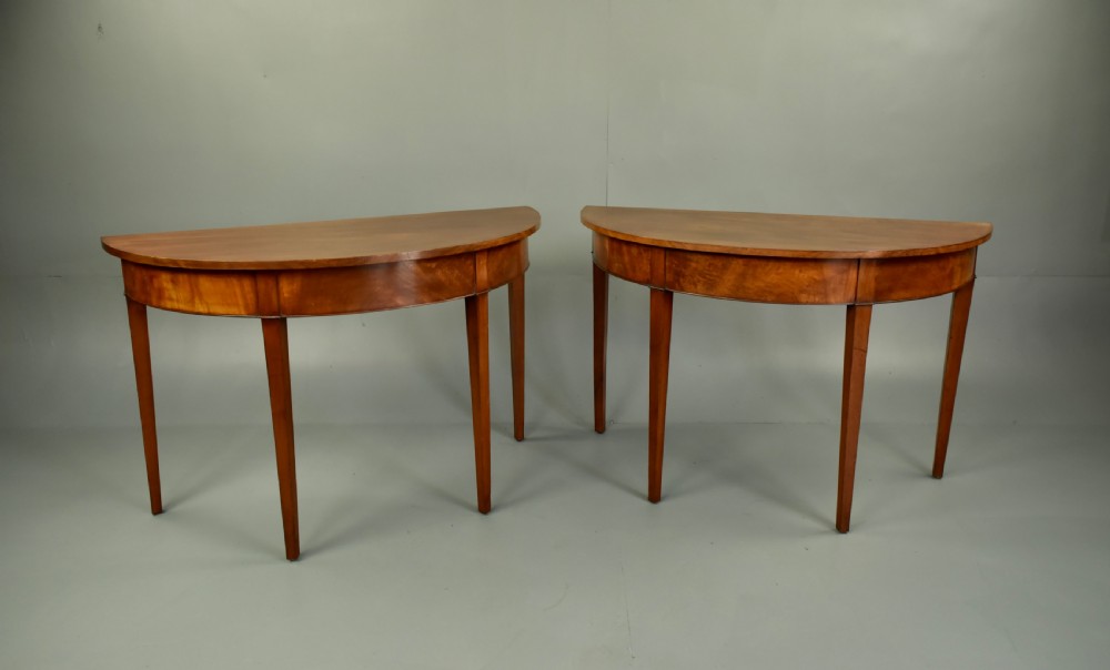 pair of Georgian mahogany demi lune console tables 
