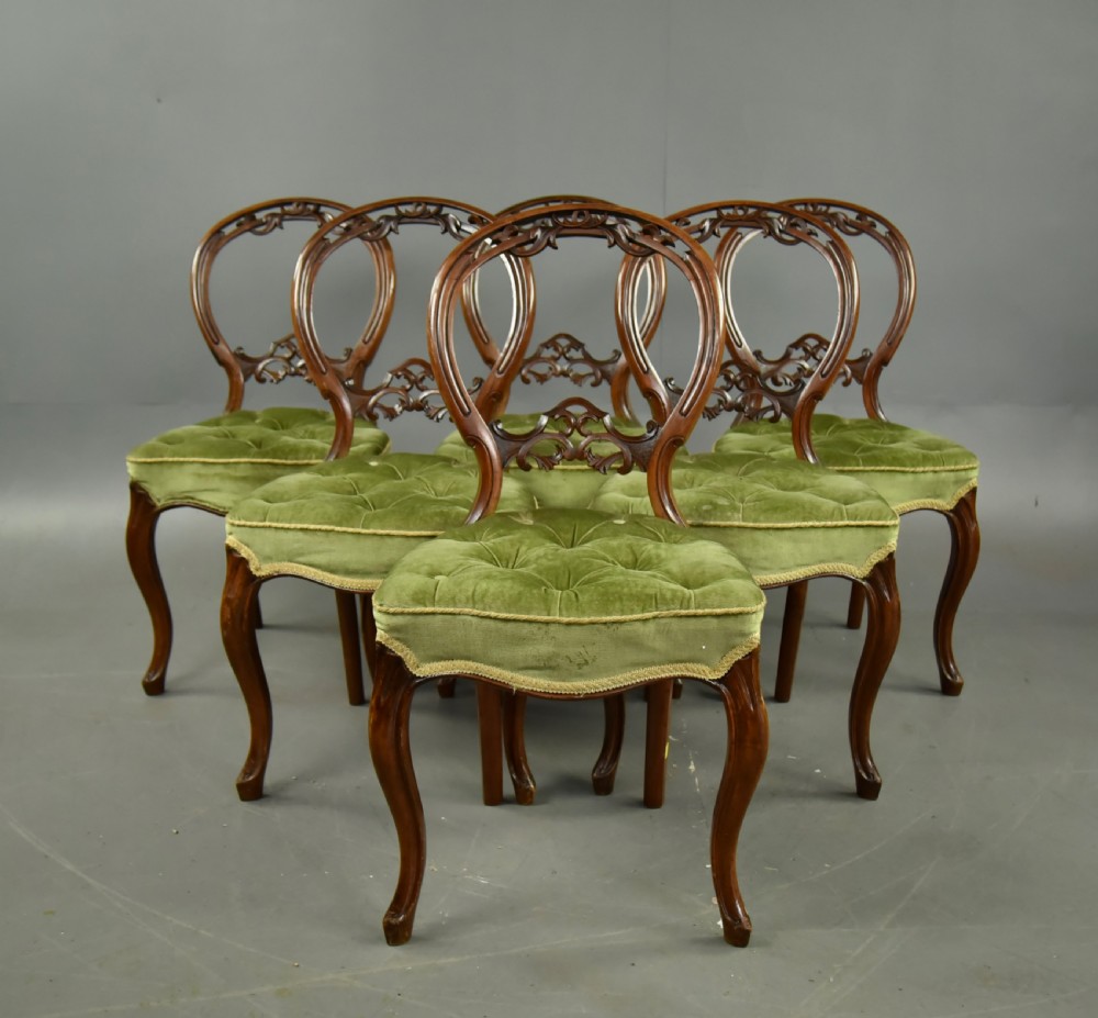 set of six Victorian walnut balloon back chairs 
