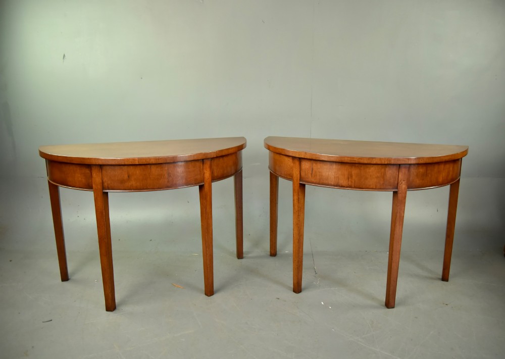 pair of Georgian mahogany demi lune console tables
