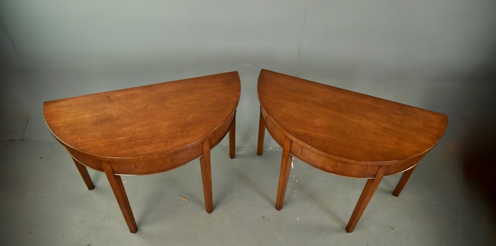 pair of Georgian mahogany demi lune console tables View II