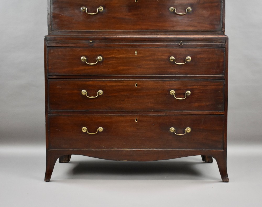 A two-section Georgian mahogany chest on chest featuring multiple drawers with brass swan-neck handles, a dentil cornice, and bracket feet. View III