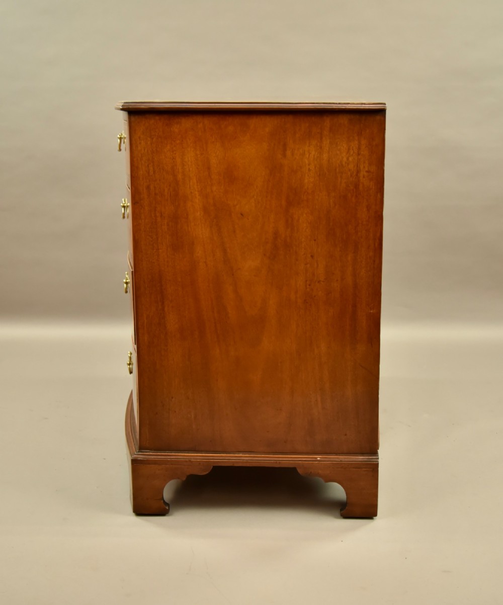 A 19th-century mahogany bowfront chest of drawers featuring two short over three long drawers with brass handles. View IV