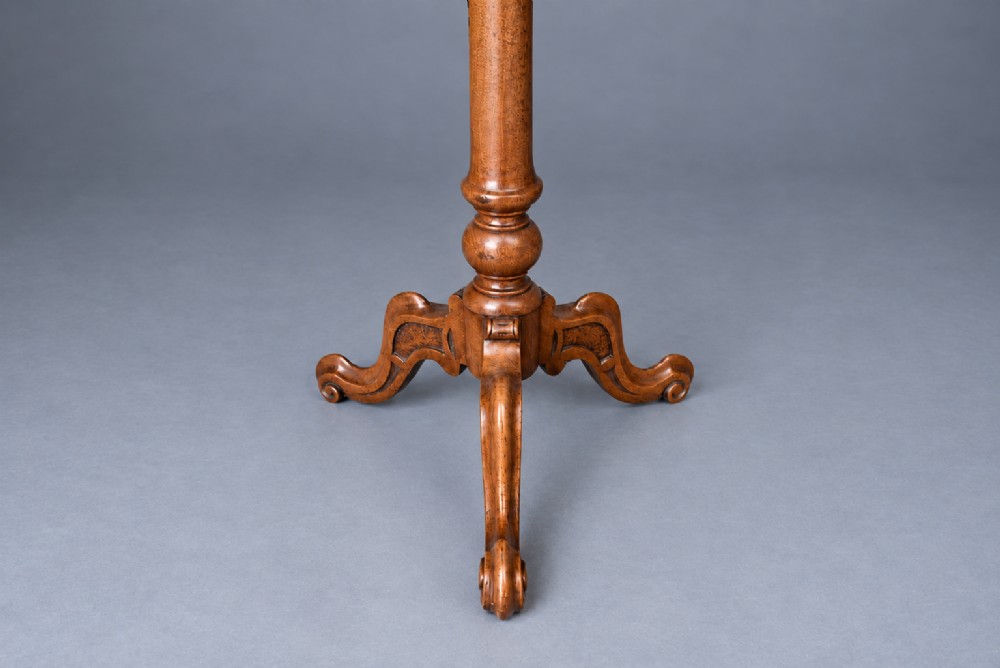 A Victorian walnut wine table with a scalloped edge tabletop decorated with floral marquetry inlay on a turned pedestal and tripod base. View III