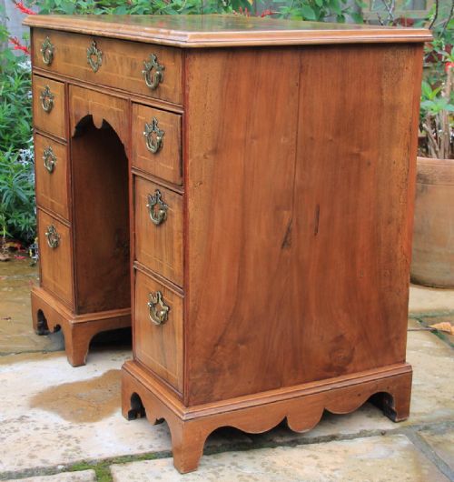 An Early 18th Century Walnut Kneehole Desk.