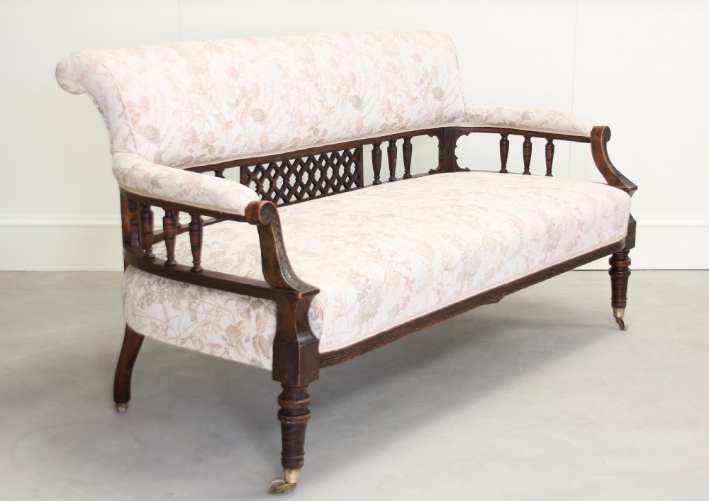 A Victorian Walnut salon three piece suite. View V